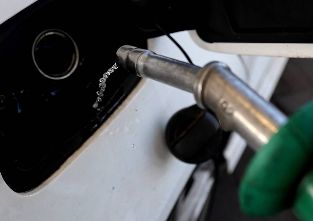 A car is filled with petrol at a filling station, in Knutsford, Cheshire, Britain, March 10, 2022. — Reuters pic