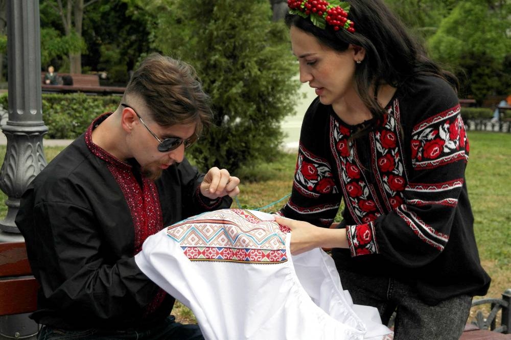 Ukrainians show off colourful shirts to celebrate unity