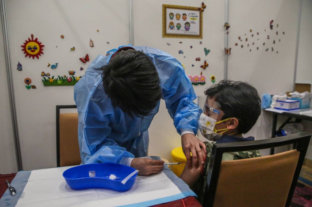 Children aged between five and 12-years-old get their Covid-19 vaccine during the National Covid-19 Immunisation Programme for Kids at the Ideal Convention Centre in Shah Alam February  3, 2022. — Picture by Yusof Mat Isa