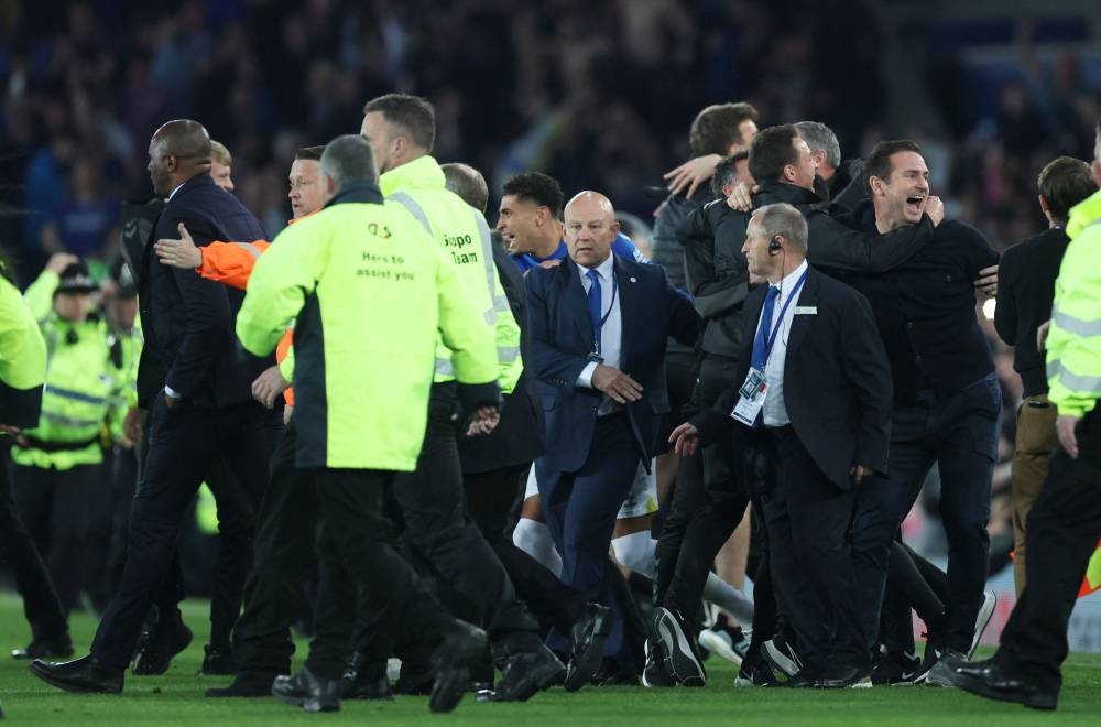 Managers warn over pitch invasions as police probe Vieira incident