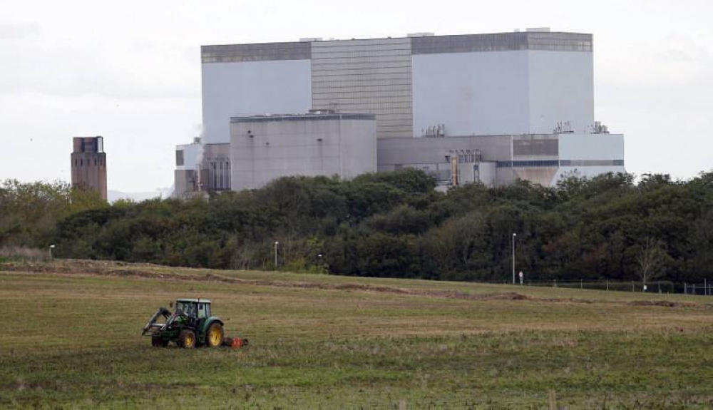 UK backs Hinkley nuclear plant after cost hiked