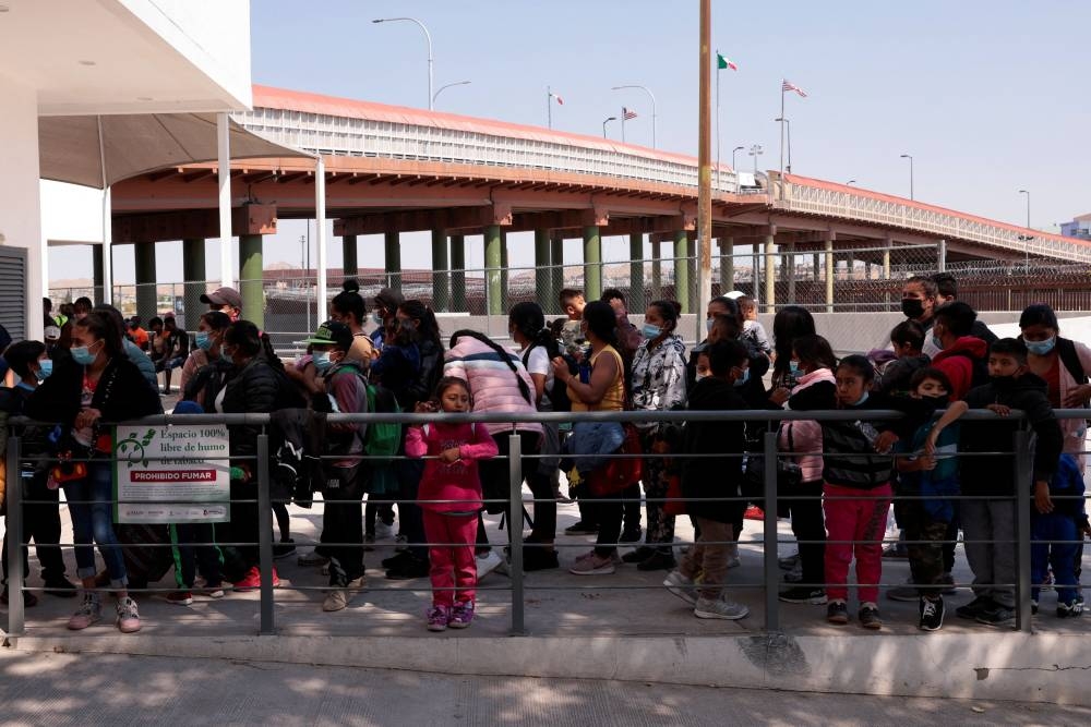 Covid restrictions for migrants at US border cannot end yet, judge rules