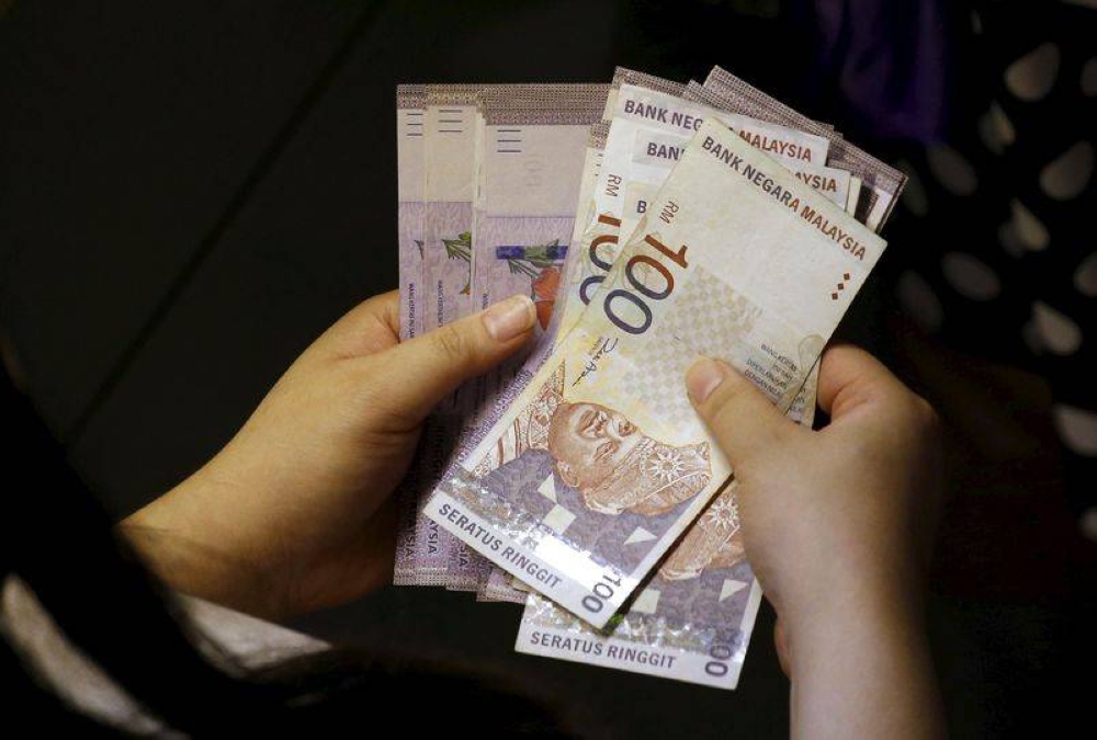 At 9.00am, the local note stood at 4.3870/3915 versus the greenback from Friday’s close of 4.3870/3910. — Reuters pic