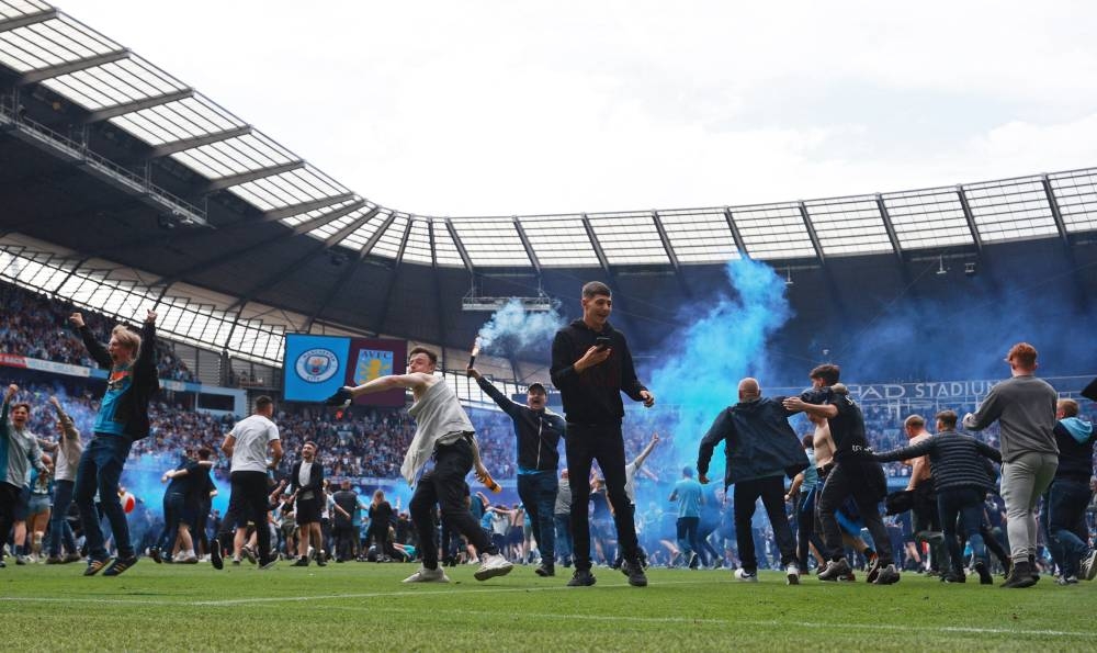 Two men charged following pitch invasion at City's win over Villa