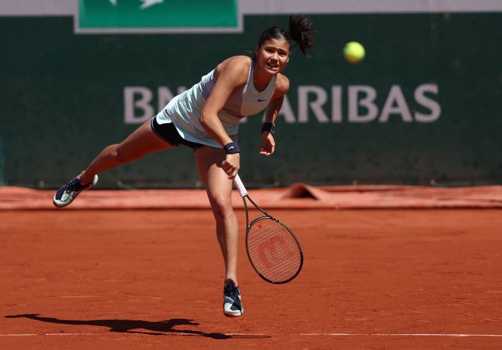 Britain’s Emma Raducanu serves to Belarus’ Aliaksandra Sasnovich during their women’s singles match on day four of the Roland-Garros Open tennis tournament at the Court Suzanne-Lenglen in Paris, May 25, 2022. — AFP pic 