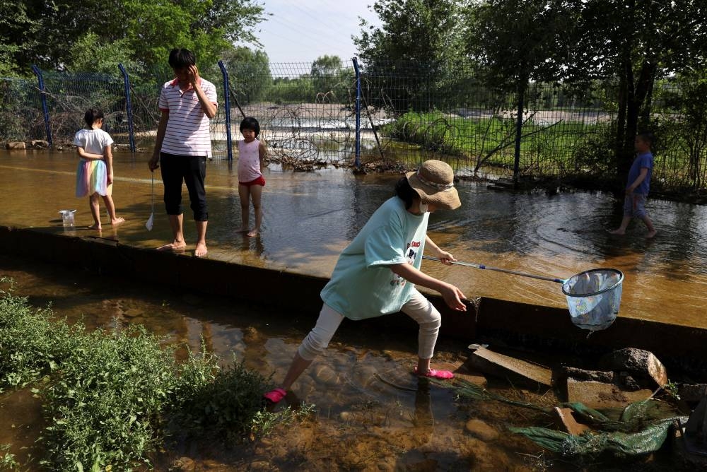 Hemmed in by Covid curbs, Beijingers seek respite in urban outdoors