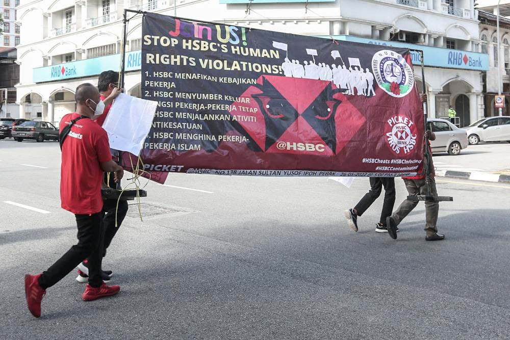 National Union of Bank Employees (Nube) members staged a picket in front of HSCB office in Ipoh May 26, 2022. — Picture by Farhan Najib