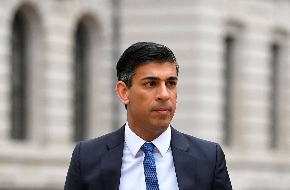 British Chancellor of the Exchequer Rishi Sunak walks near the Treasury building in London May 3, 2022. — Reuters pic