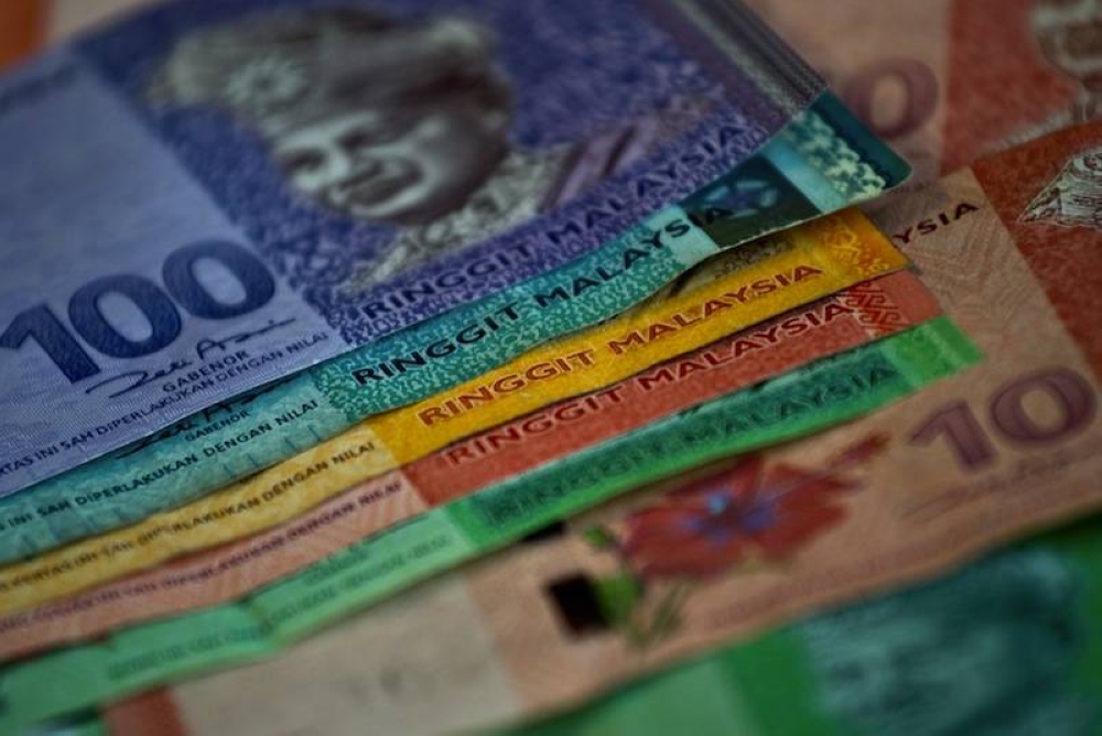 Ringgit gains momentum to end higher versus US dollar