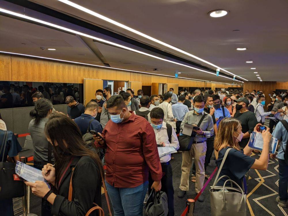 Singaporean jobseekers are seen queuing to visit recruitment booths at the OneAviation Careers event on May 27, 2022. — TODAY pic