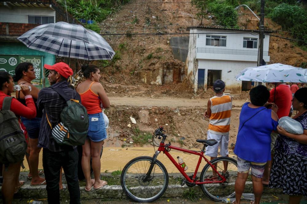 Death toll mounts from Brazil downpours as search continues