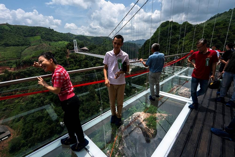 ‘Don’t look down’: Vietnam glass-bottomed bridge targets thrill-seekers