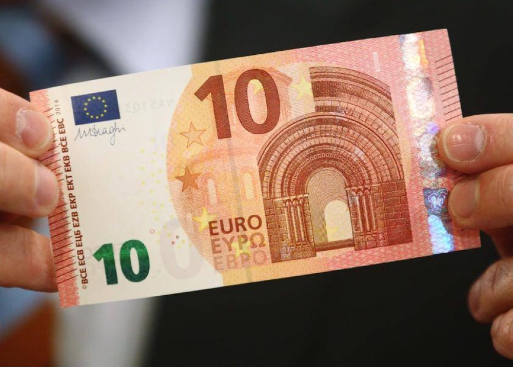 Euro edges down but set for largest monthly gain in a year