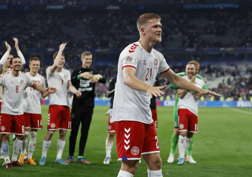 Denmark's Andreas Cornelius celebrates with fans after the match against France, June 4, 2022. ― Reuters pic