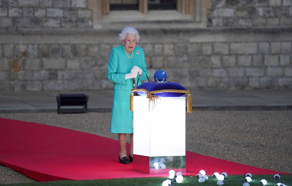 File photo of Britain’s Queen Elizabeth leading the lighting of the principal Jubilee beacon, as part of Platinum Jubilee celebrations, at Windsor Castle, Britain, in London, Britain, June 2, 2022. ― Reuters pic