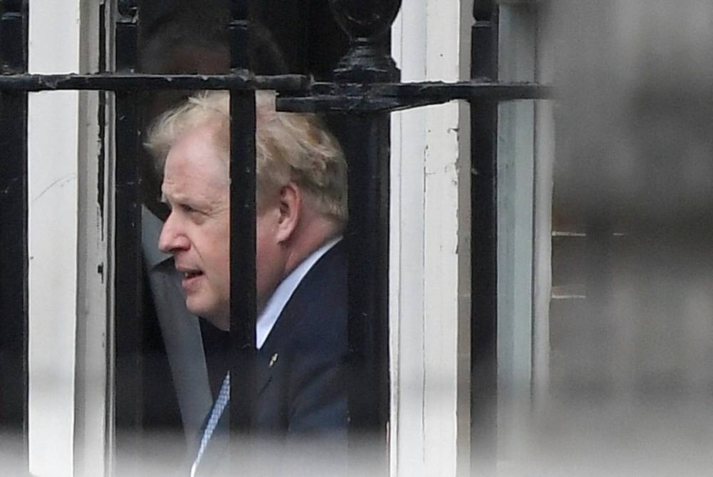 British Prime Minister Boris Johnson leaves from the back entrance of Downing Street in London June 6, 2022. — Reuters pic