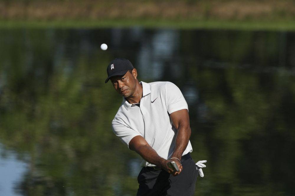 Tiger Woods chips on to the 11th green during a practice round for the PGA Championship golf tournament at Southern Hills Country Club in Tulsa May 17, 2022. — Reuters pic