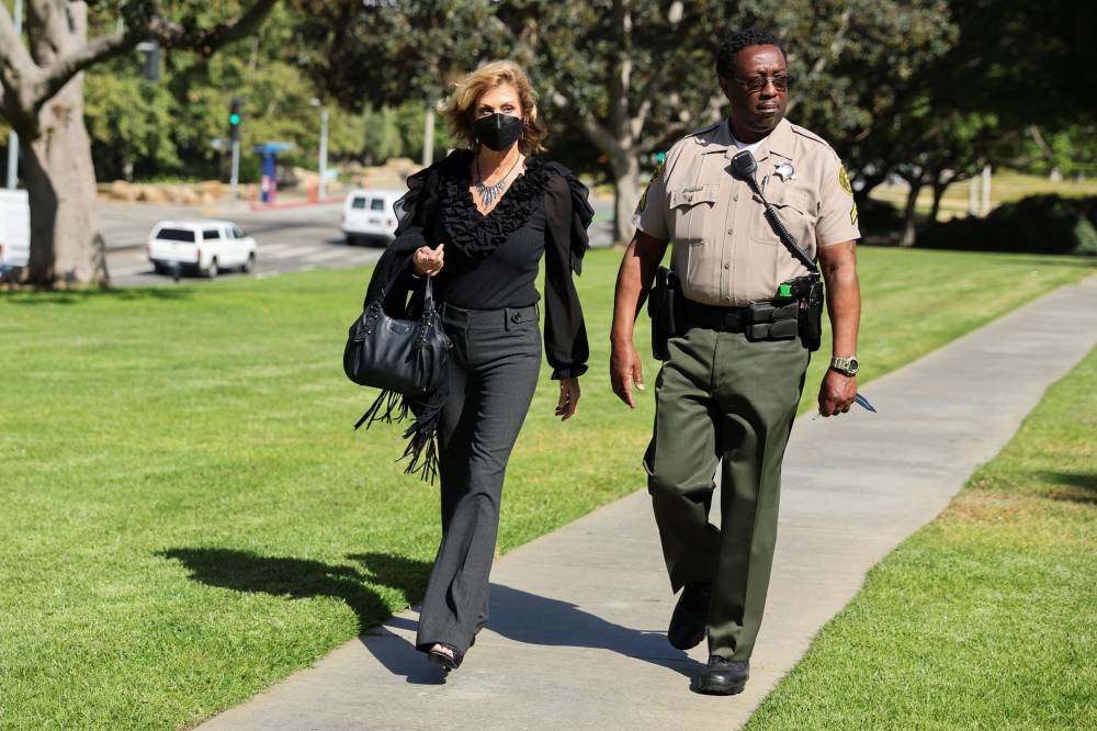 Plaintiff Judy Huth arrives with the Sheriff's Deputy for opening statements in the civil suit against Bill Cosby at Santa Monica courthouse, California,  June 1, 2022. — Reuters pic