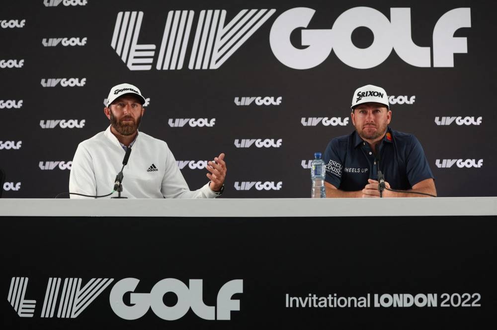 Dustin Johnson (left) of the US and Northern Ireland's Graeme McDowell during a press conference at the Centurion Club, Hemel Hempstead, Britain June 7, 2022. — Reuters pic