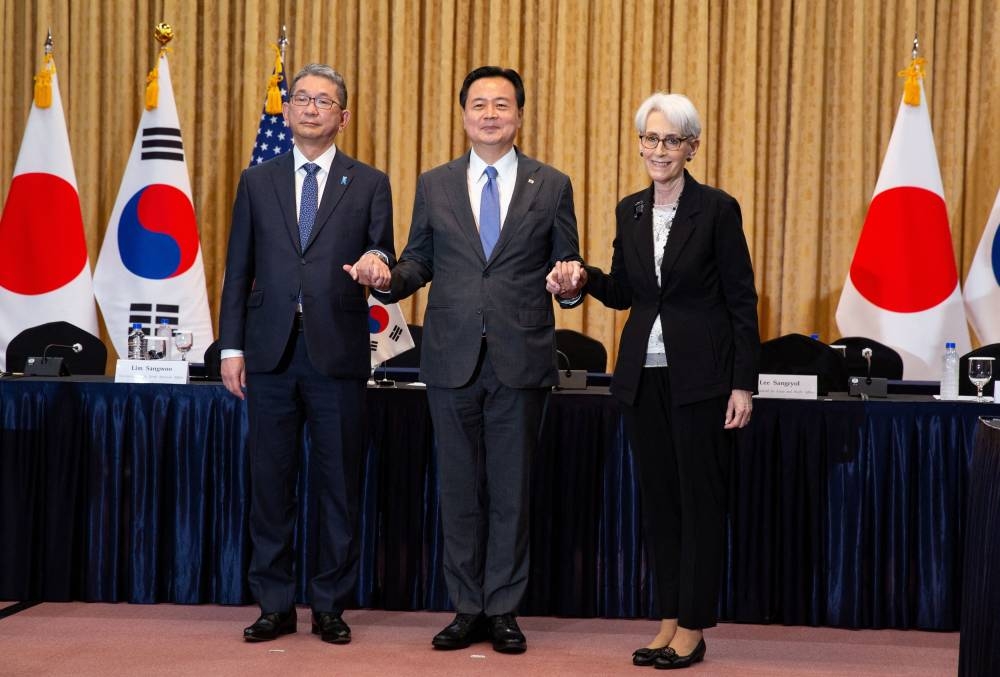 Japan’s Vice Minister for Foreign Affairs Takeo Mori, South Korea’s First Vice Foreign Minister Cho Hyun-dong and US Deputy Secretary of State Wendy Sherman pose for a photo prior their meeting at the Foreign Ministry in Seoul June 8, 2022. — Picture by Jeon Heon-Kyun/Pool pic via Reuters