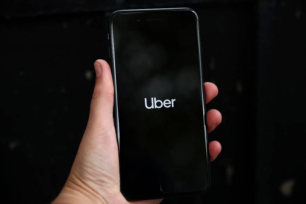 Uber’s logo is displayed on a mobile phone in London in this file picture taken on September 14, 2018. — Reuters pic 