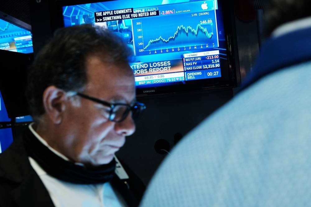 Traders work on the floor of the New York Stock Exchange (NYSE) at the start of the trading day on June 03, 2022 in New York City. — AFP pic