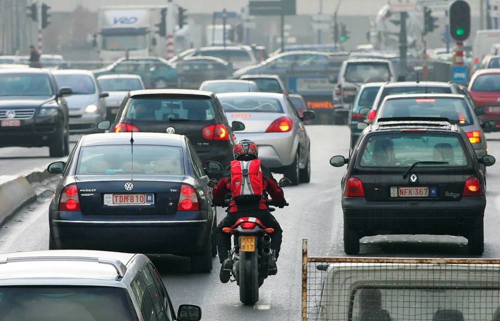 Cars drive along a road in central Brussels February 7, 2007. — Reuters pic