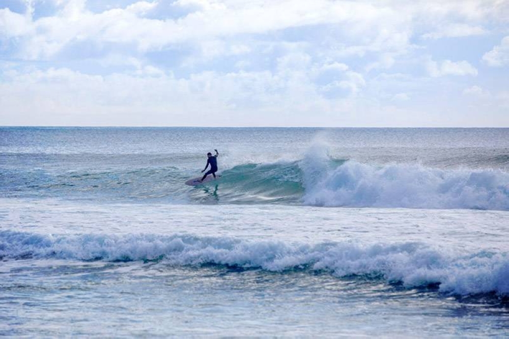 Surfing is a popular activity at Hot Water Beach.