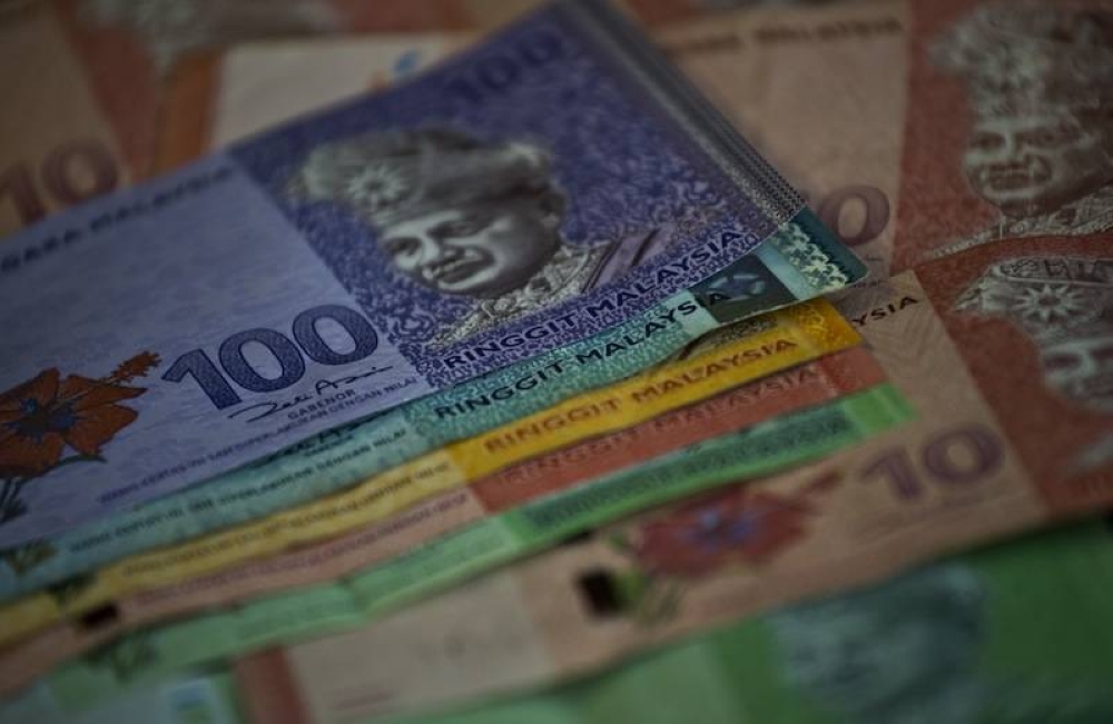 Ringgit ends higher against US dollar