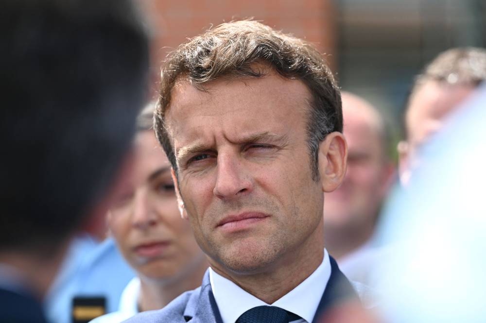 French President Emmanuel Macron looks on during a visit at the National Gendarmerie Brigade of Gaillac, France June 9, 2022. ― Caroline Blumberg/Pool via Reuters