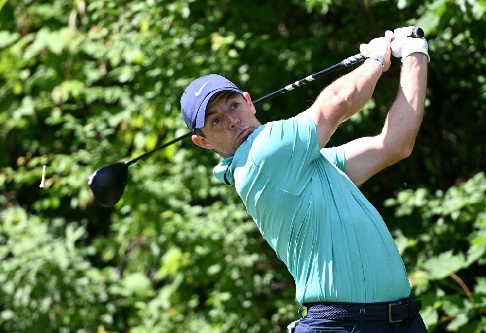 McIlroy charges but Clark clings to Canadian Open lead