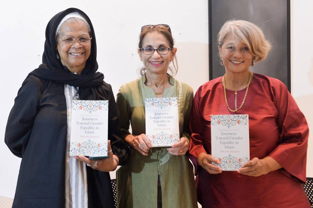 (From left) Amina Wadud, author Ziba Mir-Hosseini and Sisters In Islam (SIS) co-founder Zainah Anwar take a photo during the launch of Mir-Hosseini’s book ‘Journeys Toward Gender Equality in Islam’ in Temu House, Petaling Jaya June 7, 2022. — Picture by Miera Zulyana