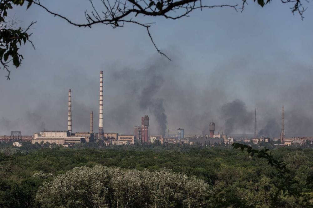 Smoke rises after a military strike on a compound of the Sievierodonetsk's Azot Chemical Plant amid Russia's attack on Ukraine continues, in the town of Lysychansk, Luhansk region, Ukraine June 10, 2022. — Reuters pic