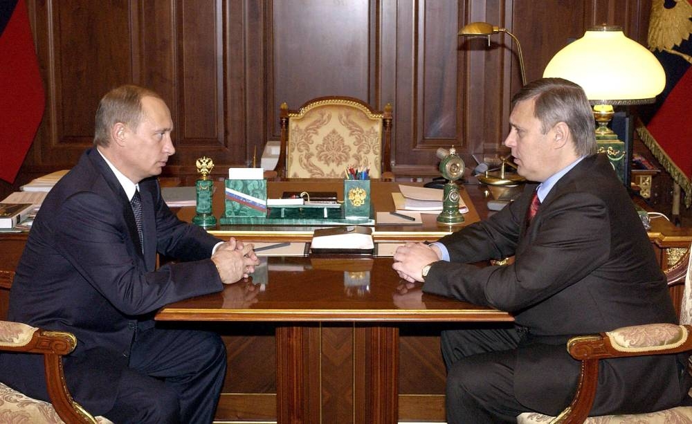 This photograph taken on February 24, 2004, shows Russian President Vladimir Putin talking to former Russian Prime Minister Mikhail Kasyanov at his office in Moscow's Kremlin. — TASS/AFP pic