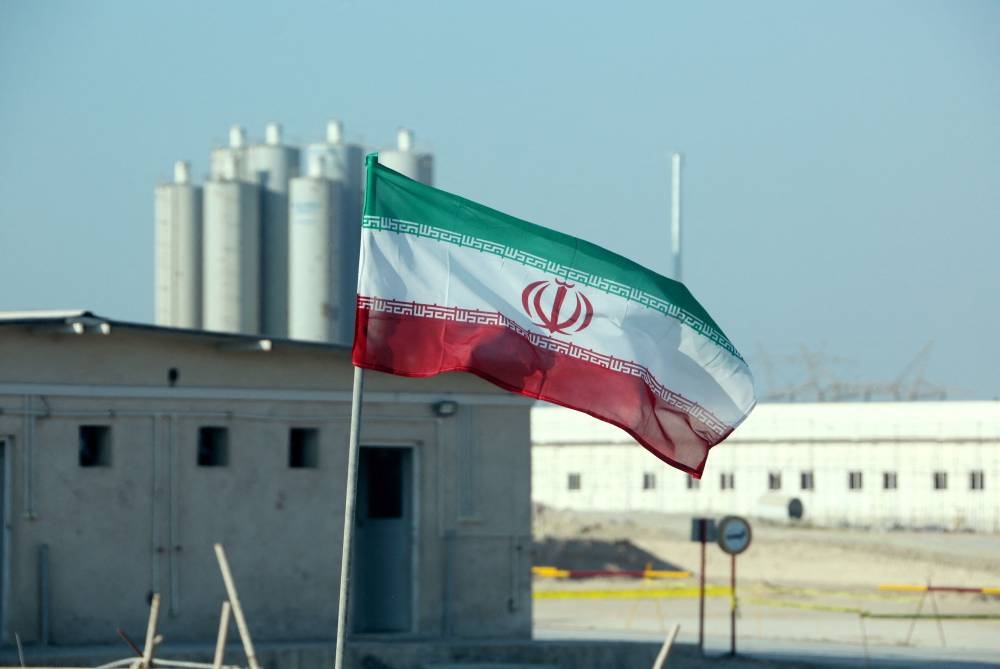 This file photo taken on November 10, 2019 shows an Iranian flag in Iran's Bushehr nuclear power plant, during an official ceremony to kick-start works on a second reactor at the facility. — AFP pic