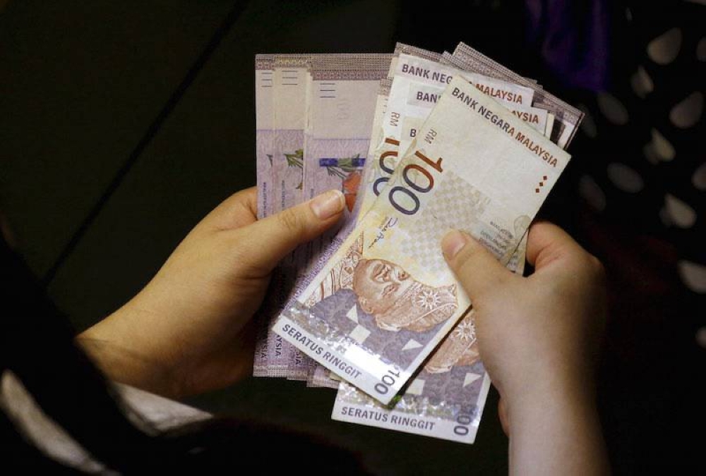 At 6pm, the local currency depreciated against the greenback to 4.4170/4185 from Friday’s close of 4.4000/4030. — Reuters pic