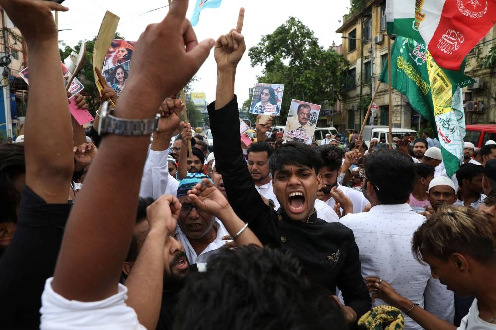 Muslims shout slogans during a protest demanding the arrest of Bharatiya Janata Party (BJP) member Nupur Sharma for her comments on Prophet Mohammed, in Kolkata June 10, 2022. — Reuters pic