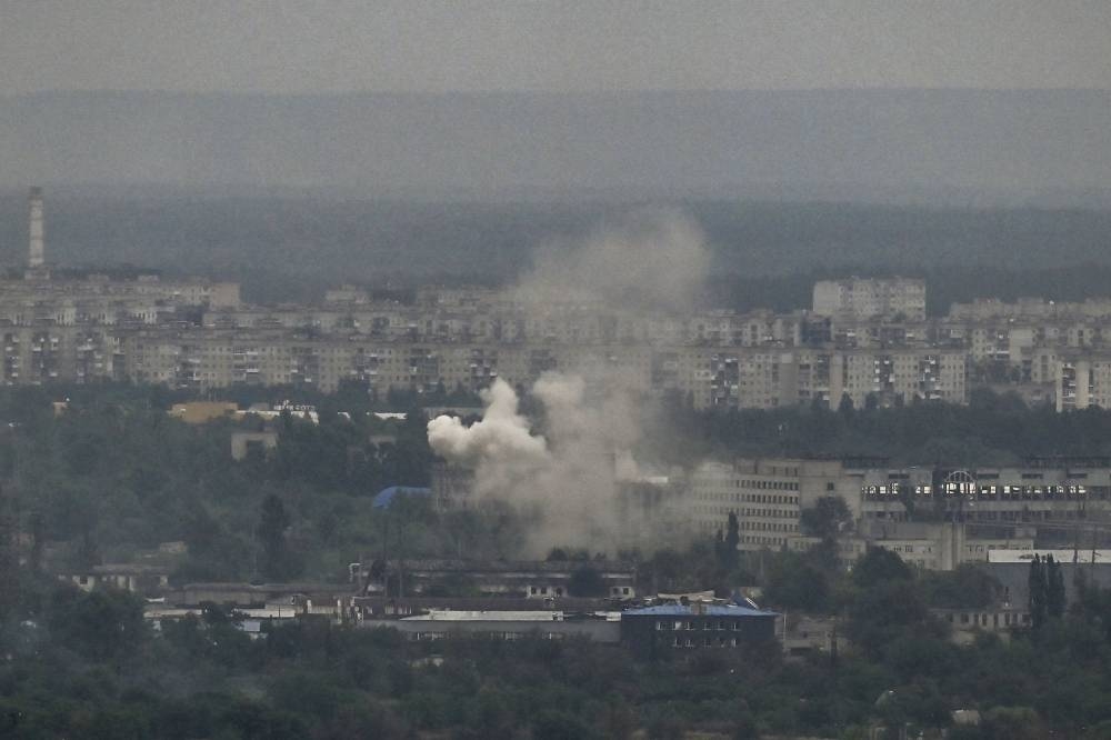 Smoke and dirt rise from the city of Severodonetsk in the eastern Ukrainian region of Donbas on June 13, 2022, amid Russian invasion of Ukraine. — AFP pic