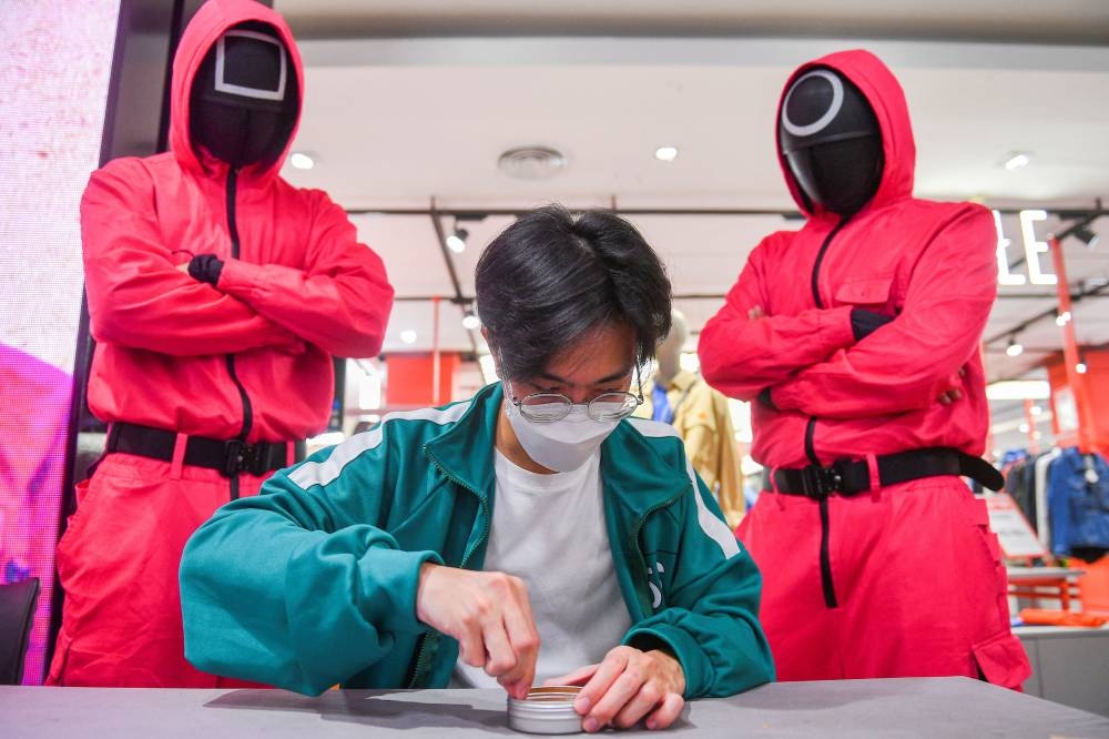 A man participates in a Netflix series 'Squid Game' mission at a department store in Bangkok, Thailand, November 20, 2021. ― Reuters file pic