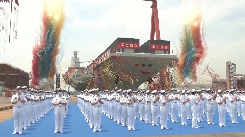 This screen grab made from video released by Chinese state broadcaster CCTV shows the launch ceremony of the Fujian, a People's Liberation Army (PLA) aircraft carrier, at a shipyard in Shanghai on June 17, 2022. — CCTV/AFP pic