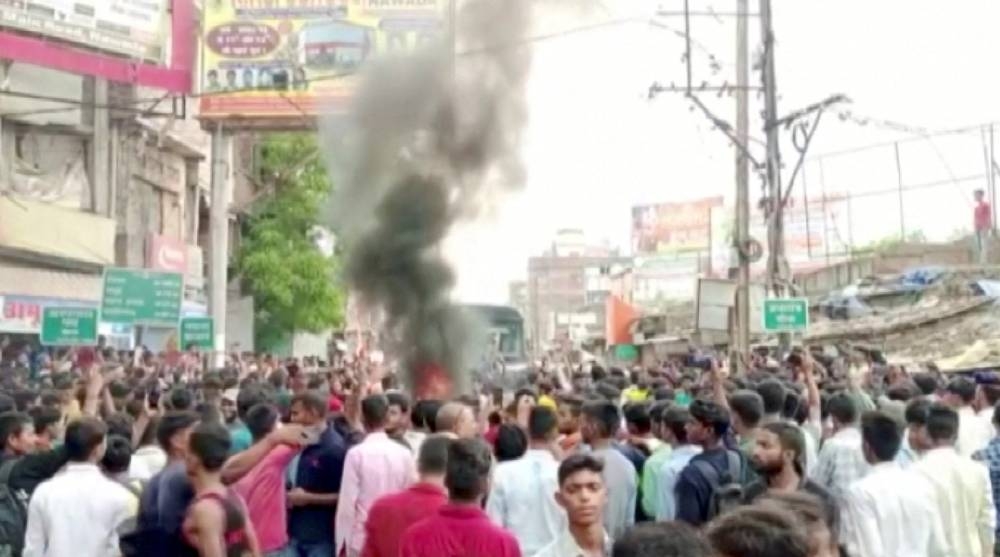 Indian trains set ablaze in protests against military hiring changes