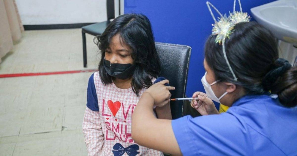 A child gets her Covid-19 jab during the National Covid-19 Immunisation Programme for Kids at the Perak Community Specialist Hospital in Ipoh February 25, 2022. — Picture by Farhan Najib