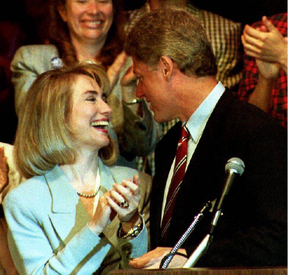 In this file photo taken on July 14, 1992 Democratic presidential nominee Bill Clinton (right) is applauded by his wife Hillary, before his address to the Women’s Caucus of the 1992 Democratic National Convention, New York. ― AFP pic