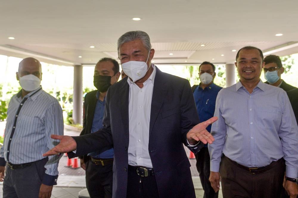 Former home minister Datuk Seri Ahmad Zahid Hamidi arrives during a visa trial at Shah Alam High Court, June 14, 2022. — Picture by Miera Zulyana