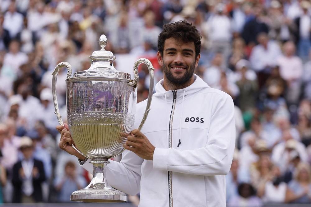 Italy's Matteo Berrettini celebrates with the trophy after winning his final match against Serbia's Filip Krajinovic. — Action Images via Reuters/Andrew Couldridge