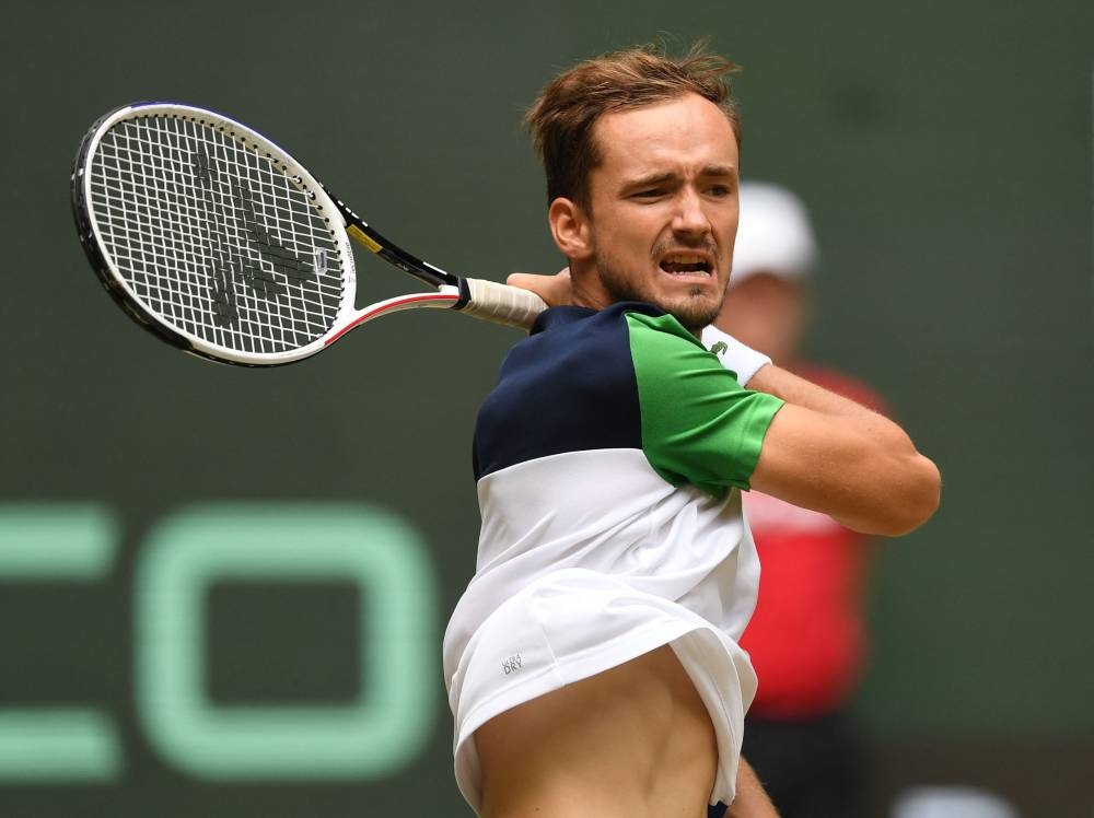 Russia's Daniil Medvedev returns to Poland's Hubert Hurkacz during the men's singles final match at the ATP 500 Halle Open tennis tournament in Halle, western Germany, on June 19, 2022. — AFP pic