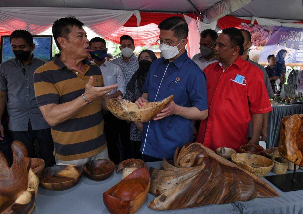 Senior Minister of International Trade and Industry Datuk Seri Mohamed Azmin Ali is seen during a working visit to the Balik Pulau Craft Incubator Centre in Balik Pulau June 20, 2022. — Bernama pic