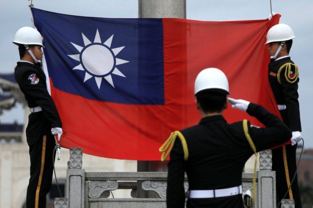 Military honour guards attend a flag-raising ceremony at Chiang Kai-shek Memorial Hall, in Taipei, Taiwan March 16, 2018. - Reuters pic