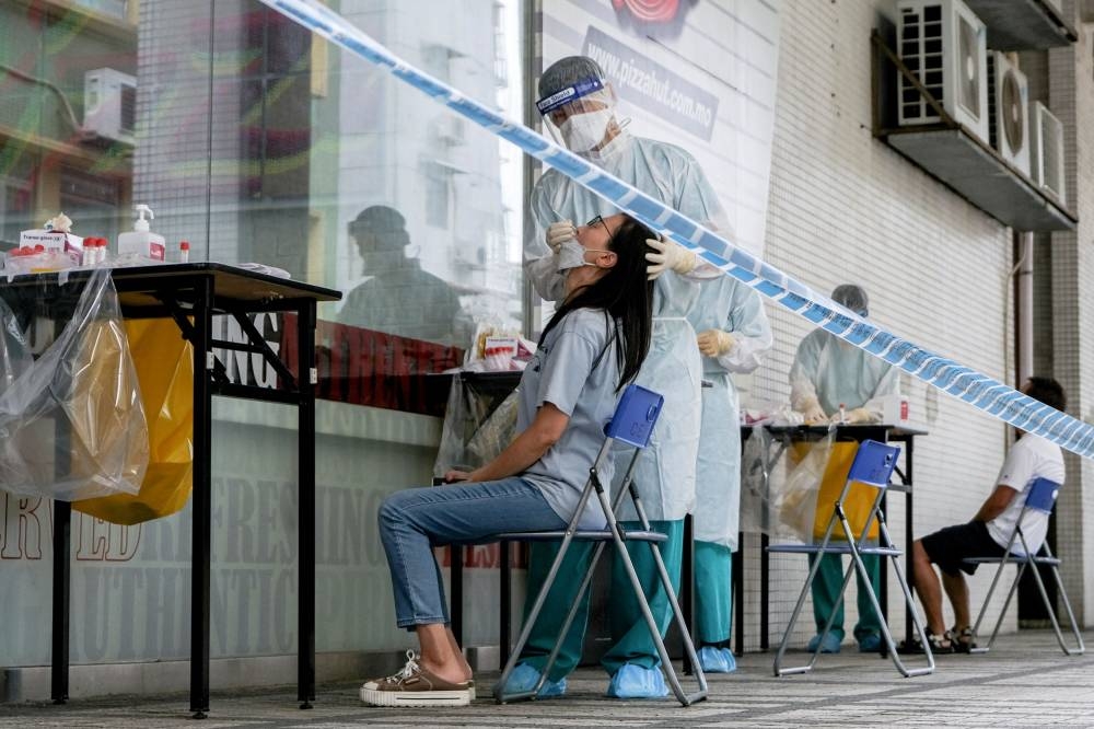 A woman tests for Covid-19 in Macau, China June 19, 2022. ― Reuters pic