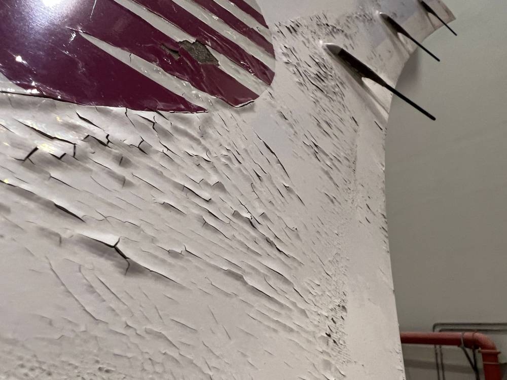 Surface damage seen on Qatar Airways' airbus A350 parked at Qatar airways aircraft maintenance hangar in Doha June 20, 2022. — Reuters pic